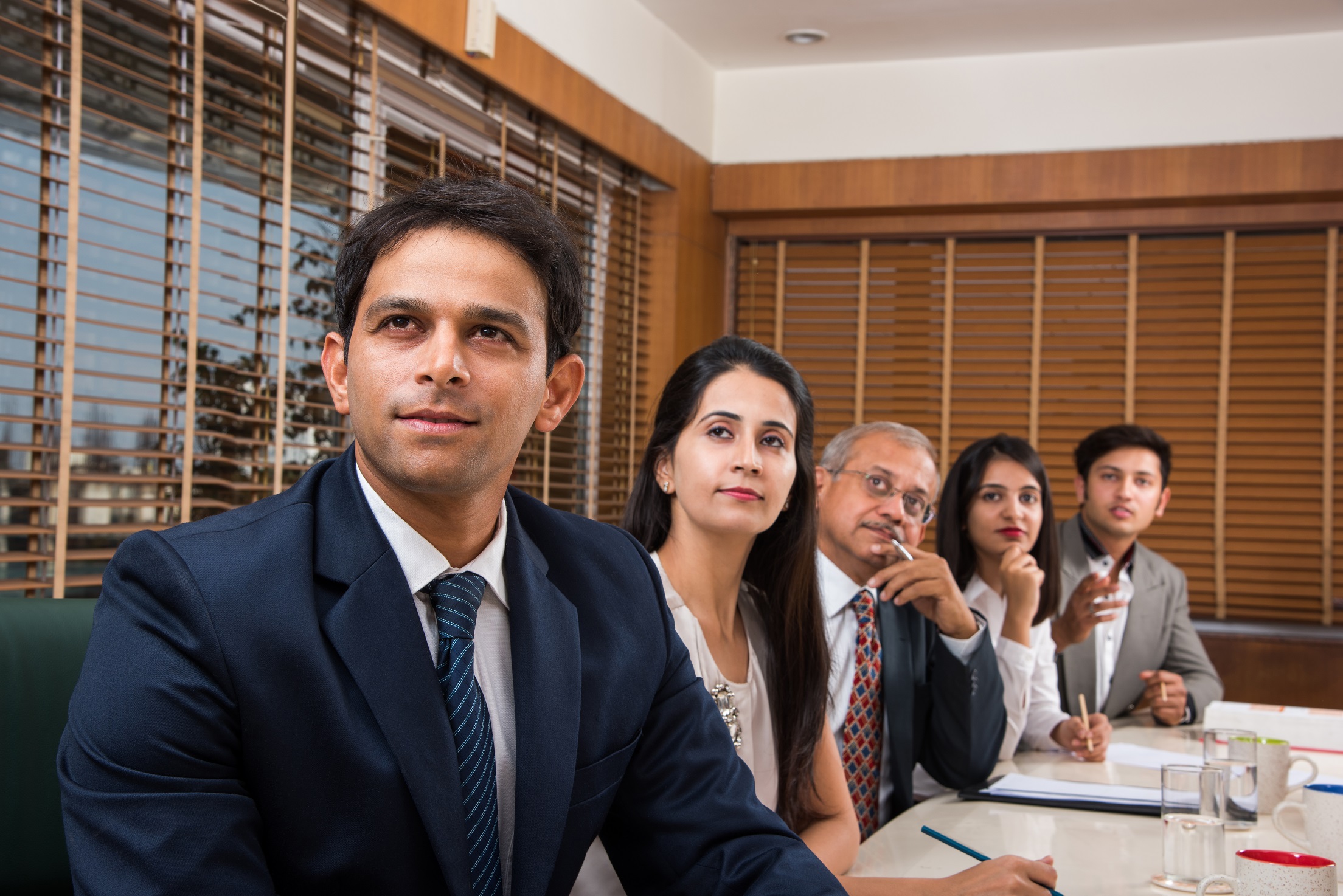 Asian Indian Business People or Corporate culture and Working in the office Concept with Laptop, papers, meetings, presentations and discussions